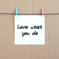 Love what you do. Note is written on a white sticker that hangs Royalty Free Stock Photo