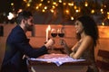 Love, wine and toast of couple on date for fine dining, restaurant or night valentine celebration together. Happy black