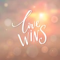 Love wins - insirational quote at sunrise background with bokeh Royalty Free Stock Photo