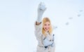 Love winter. Funny winter girl play with snow. Happy amazed girl in the snow make snowball. Winter activities in cold