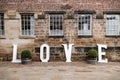 LOVE wooden letters outdoors in beautiful romantic courtyard Royalty Free Stock Photo