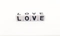 love word built with white cubes and black letters on white background
