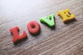 `love` word Close-up shot with a selective focus of the colorful magnetic letters for Valentine`s Day Royalty Free Stock Photo