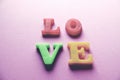 `love` word Close-up shot with a selective focus of the colorful magnetic letters for Valentine`s Day Royalty Free Stock Photo