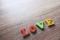 `love` word Close-up shot with a selective focus of the colorful magnetic letters for Valentine`s Day Royalty Free Stock Photo