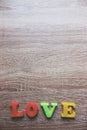 `love` word Close-up shot with a selective focus of the colorful magnetic letters for Valentine`s Day Royalty Free Stock Photo