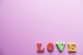 `love` word Close-up shot with a selective focus of the colorful magnetic letters for Valentine`s Day Royalty Free Stock Photo