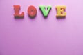 `love` word Close-up shot with a selective focus of the colorful magnetic letters for Valentine`s Day Royalty Free Stock Photo