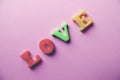 `love` word Close-up shot with a selective focus of the colorful magnetic letters for Valentine`s Day Royalty Free Stock Photo
