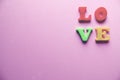 `love` word Close-up shot with a selective focus of the colorful magnetic letters for Valentine`s Day Royalty Free Stock Photo