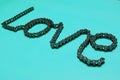 Love. The word Love, laid out from a motorcycle chain Royalty Free Stock Photo