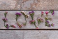 Love word made of statice limonium flowers.