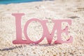 Love word on natural tropical background Royalty Free Stock Photo