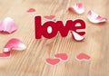 Love word and rose petal Royalty Free Stock Photo