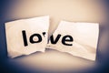 Love word on torn paper - broken love