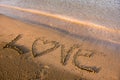 Love word written in sand Royalty Free Stock Photo