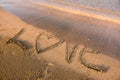Love word written in sand Royalty Free Stock Photo