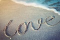 Love word written on a tropical beach Royalty Free Stock Photo