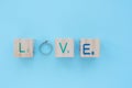 Love wording on a wooden cube. letter O replace with a ring