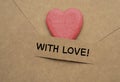 With love words on envelop with wooden heart