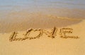 Love write on the sand beach Royalty Free Stock Photo