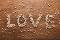 `Love` writing made out of little wooden hearts Royalty Free Stock Photo