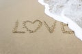 love written on golden sandy beach Royalty Free Stock Photo