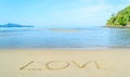 Love - written by hand in sand Royalty Free Stock Photo