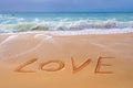 Love written on the sand of a beach, Valentines day Royalty Free Stock Photo