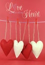 Love you with all my Heart message with red and cream hearts hanging from pegs on a line Royalty Free Stock Photo