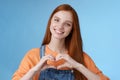 Love you. Attractive romantic tender redhead smiling gentle girlfriend blue eyes freckles show heart chest express