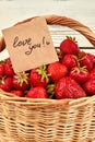 Love you card and fresh strawberries. Royalty Free Stock Photo