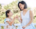 Love you forever and a lifetime, I promise. an adorable little girl playing pink swear with her mother in a garden.