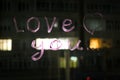 Love you, inscription text by lipstick on the window glass in the night. Love concept. Royalty Free Stock Photo