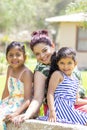 Love between a young mother and her two pretty daughters Royalty Free Stock Photo