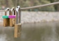 Lovelocks placed by lovers on the wires of a bridge Royalty Free Stock Photo
