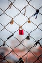 Lovelocks: The romantic tradition of sweethearts locking padlocks to a fence on a bridge, symbolizing their enduring love for each