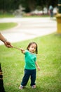 Lovely active little asian girl playing with soap bubble outdoor in the park Royalty Free Stock Photo