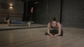 Lovely active sporty fitness woman standing in yoga plank position at gym