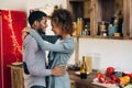 Lovely black couple embracing in cozy kitchen Royalty Free Stock Photo