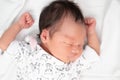 Lovely Asian baby infant sleeping on soft bed. portrait of newborn child. Royalty Free Stock Photo