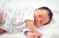 Lovely Asian baby infant sleeping on soft bed. portrait of newborn child. Royalty Free Stock Photo