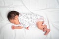 Lovely Asian baby infant sleeping on soft bed. portrait of newborn child. Royalty Free Stock Photo