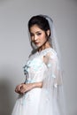 Lovely Asian Beautiful Woman bride in white wedding gown dress w Royalty Free Stock Photo
