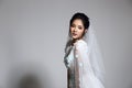 Lovely Asian Beautiful Woman bride in white wedding gown dress w Royalty Free Stock Photo