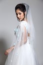 Lovely Asian Beautiful Woman bride in white wedding gown dress w Royalty Free Stock Photo