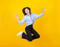 Lovely Asian girl as business secretary enjoy funny game play of jumping and happy upward fly with smile and lively on dress of Royalty Free Stock Photo