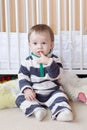 Lovely baby against white bed at home Royalty Free Stock Photo