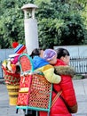 Lovely baby in basket carried by mothers.