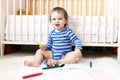 Lovely baby with pens Royalty Free Stock Photo